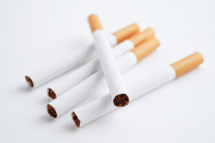 Cigarette, roll tobacco in paper with filter tube, No smoking concept.