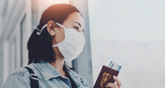 Woman, thinking and mask in airport for travel, protection and airline covid 19 policy. Immigrant, passport and PPE at window for journey, safety and waiting for flight with Mpox awareness and health