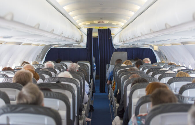 Commercial aircraft cabin with passengers