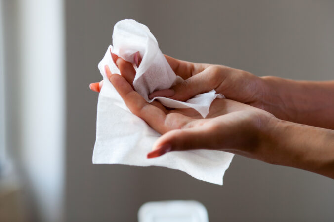 Cleaning fingers with wet wipes