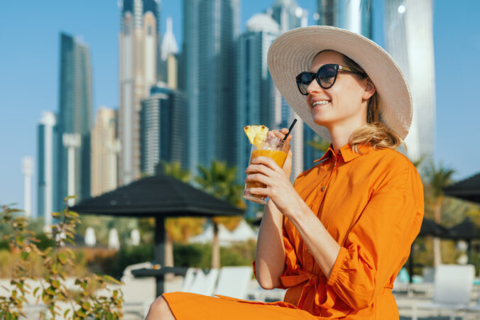 Woman enjoying vacations at Dubai marina beach resort