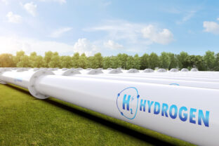 Metal pipeline with green field and blue sky background