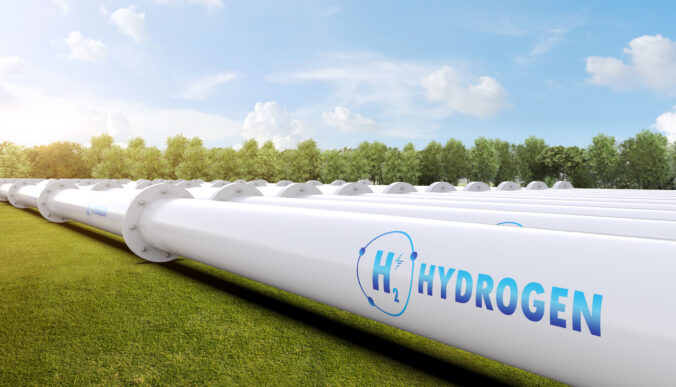 Metal pipeline with green field and blue sky background