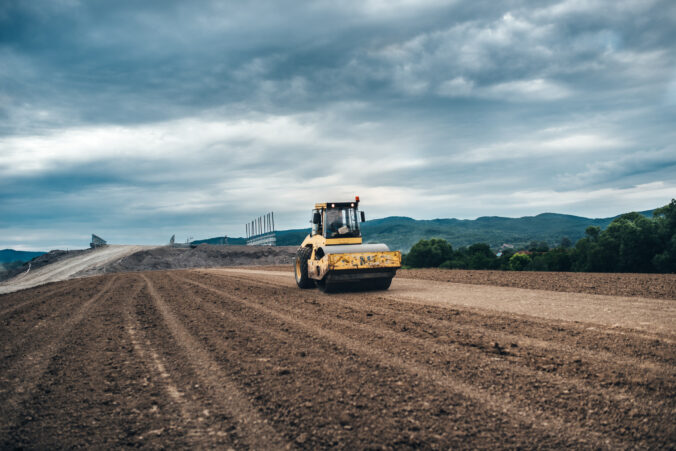 Highway construction site details - working tandem vibration machinery