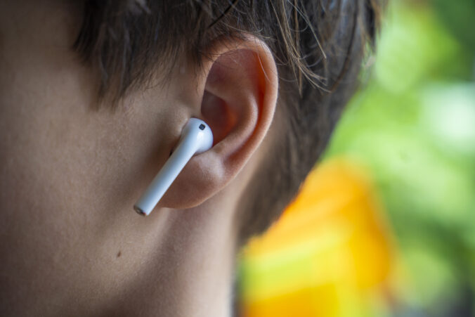 Close Up of Teenager wearing Ear pods