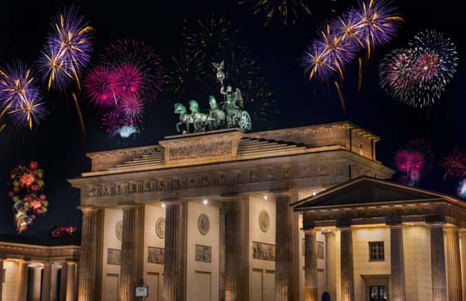 New Year&#039;s Eve party at the Brandenburg Gate, Berlin in the New Year. Brandenburger Tor (Brandenburg Gate) one of the best known landmarks and national symbols of Germany by celebrating.