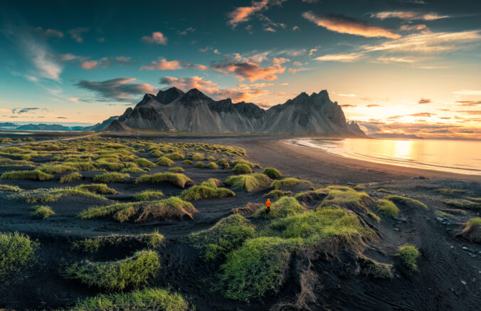 Sunrise over Vestrahorn mountain on black sand beach in Stokksnes peninsula at Iceland