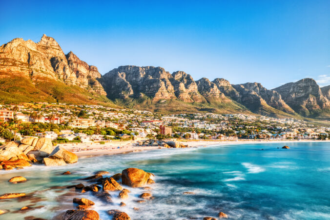 Cape Town Sunset over Camps Bay Beach with Table Mountain and Twelve Apostles in the Background