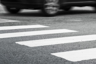 Pedestrian crossing marking and fast moving car