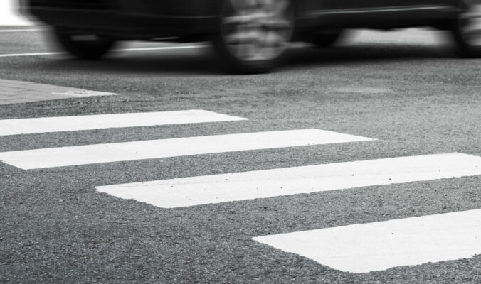 Pedestrian crossing marking and fast moving car