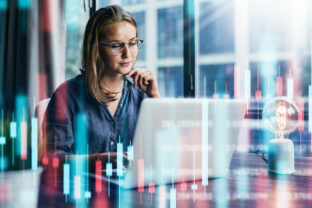 Businesswoman working at modern office.Technical price graph and indicator, red and green candlestick chart and stock trading computer screen background. Double exposure. Trader analyzing data