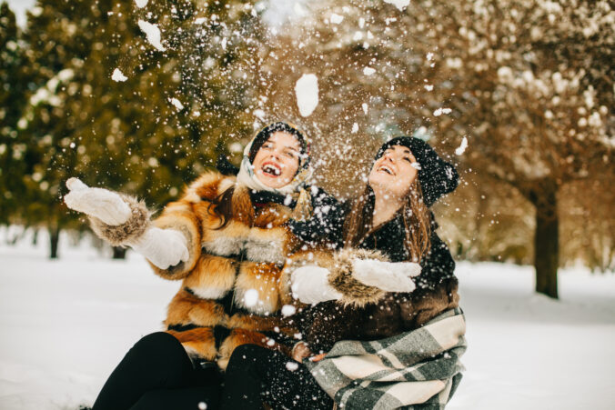 Young women have fun during the snowball fight