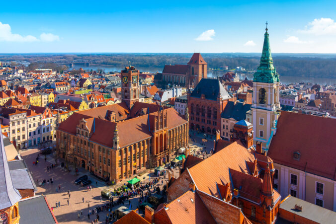 Aerial panoramic view of historical buildings and roofs in Polish medieval town Torun