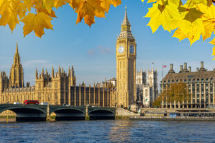 Big Ben with Houses of Parliament and Westminster bridge in autumn, London, UK