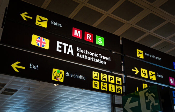 Information panel with ETA word on it at an international airport.