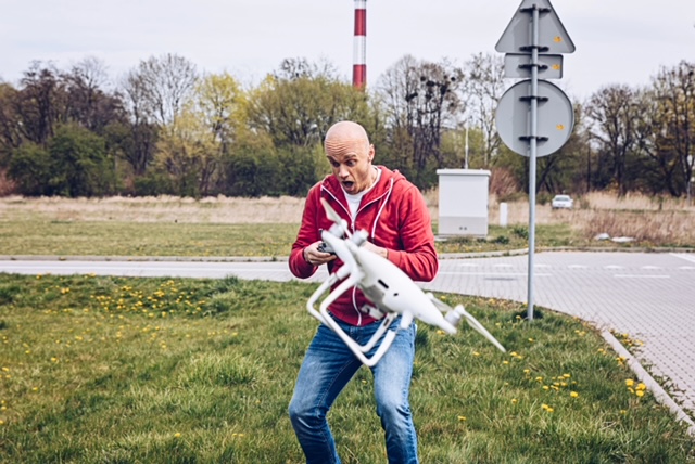 Shocked worried man after losing control of his drone.