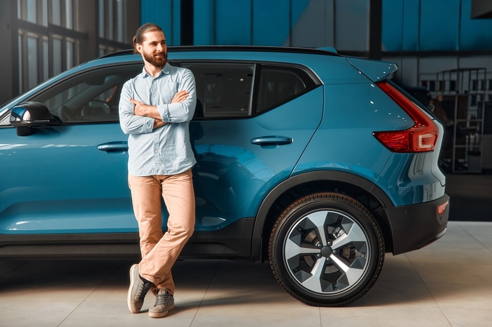 Caucasian,Bearded,Man,In,Shirt,Standing,At,His,Dream,Car