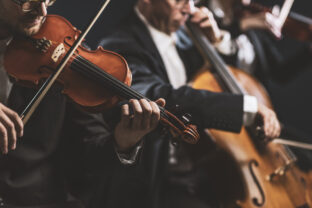 Symphonic string orchestra performing on stage