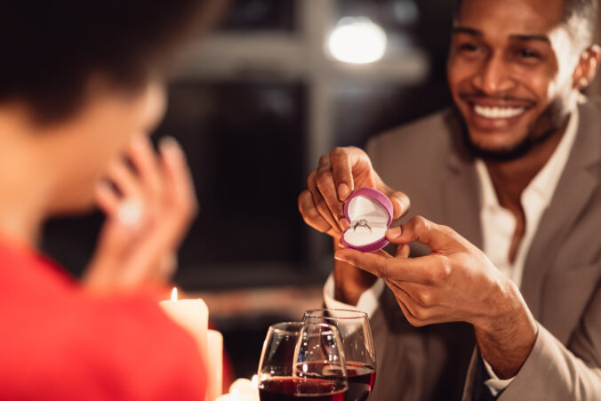 Afro Man Giving Girlfriend Engagement Ring, Romantic Date In Restaurant