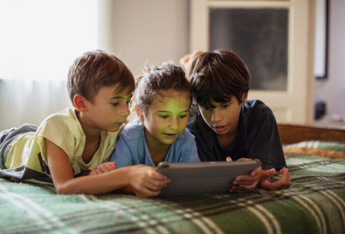 Portrait of boys using a digital tablet