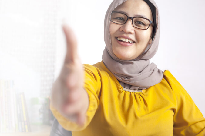 Muslim Businesswoman Offering Hand Shake