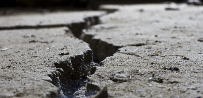 Cracked road concrete close up