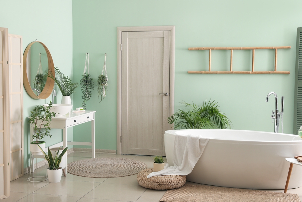 Interior,Of,Bathroom,With,Modern,Bathtub,,Ceramic,Sink,And,Houseplants