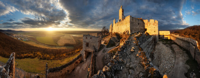 Ruin of castle Plavecky in Slovakia - Panorama of dramatic sunset