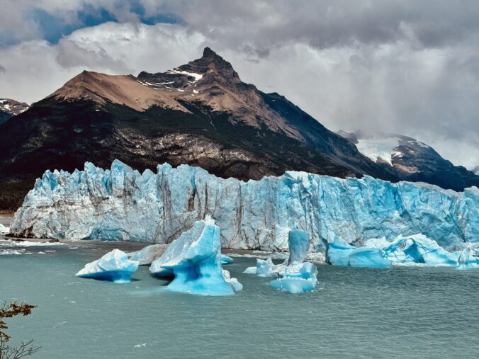 Blue glacial icebergs calve from the perito moreno glacier located in los glaciares national park in argentinan patagonia