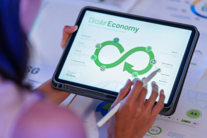 ESG ( environment, social,governance) recycle sign on laptop screen with carbon free chart board in office