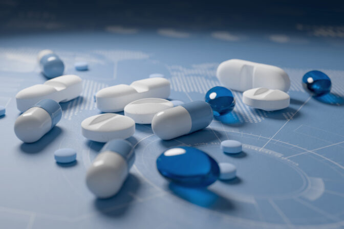 Heap of medications on blue background