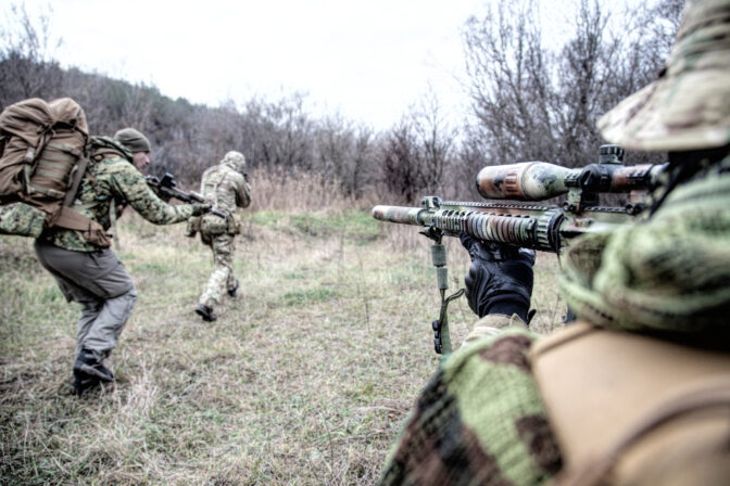 Commando army soldiers fighters squad rushing in woodland