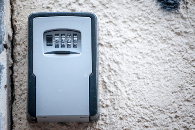 Lockbox, also called keysafe, or key safe, in front of the entrance door of a short term vacation rental, made at delivering keys to guests without contacts.