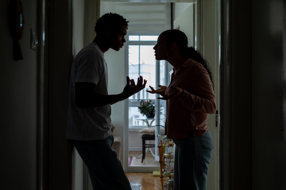 Stressed couple arguing, blaming each other