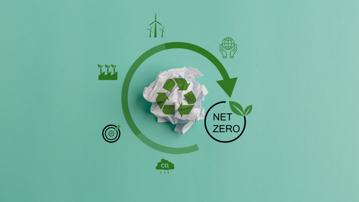 Ecology concept with paper ball trash and green recycle symbol.Zero waste, net zero concept. Carbon neutral. Climate neutral long term strategy. Sustainable business development. Reuse Reduce Recycle