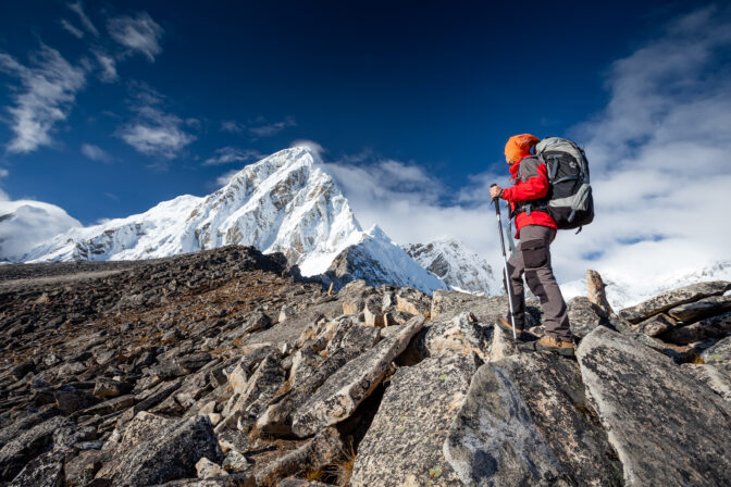 Hiker walks on train in Himalayas