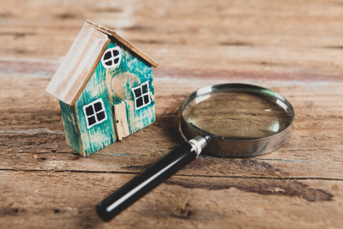 House and magnifying glass