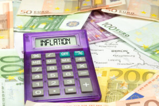 Map of Germany, euro banknotes, a calculator and inflation