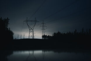 High voltage power line at night