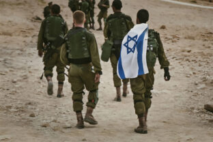 Back shot of several soldiers of israel army walking with israel national flag.
