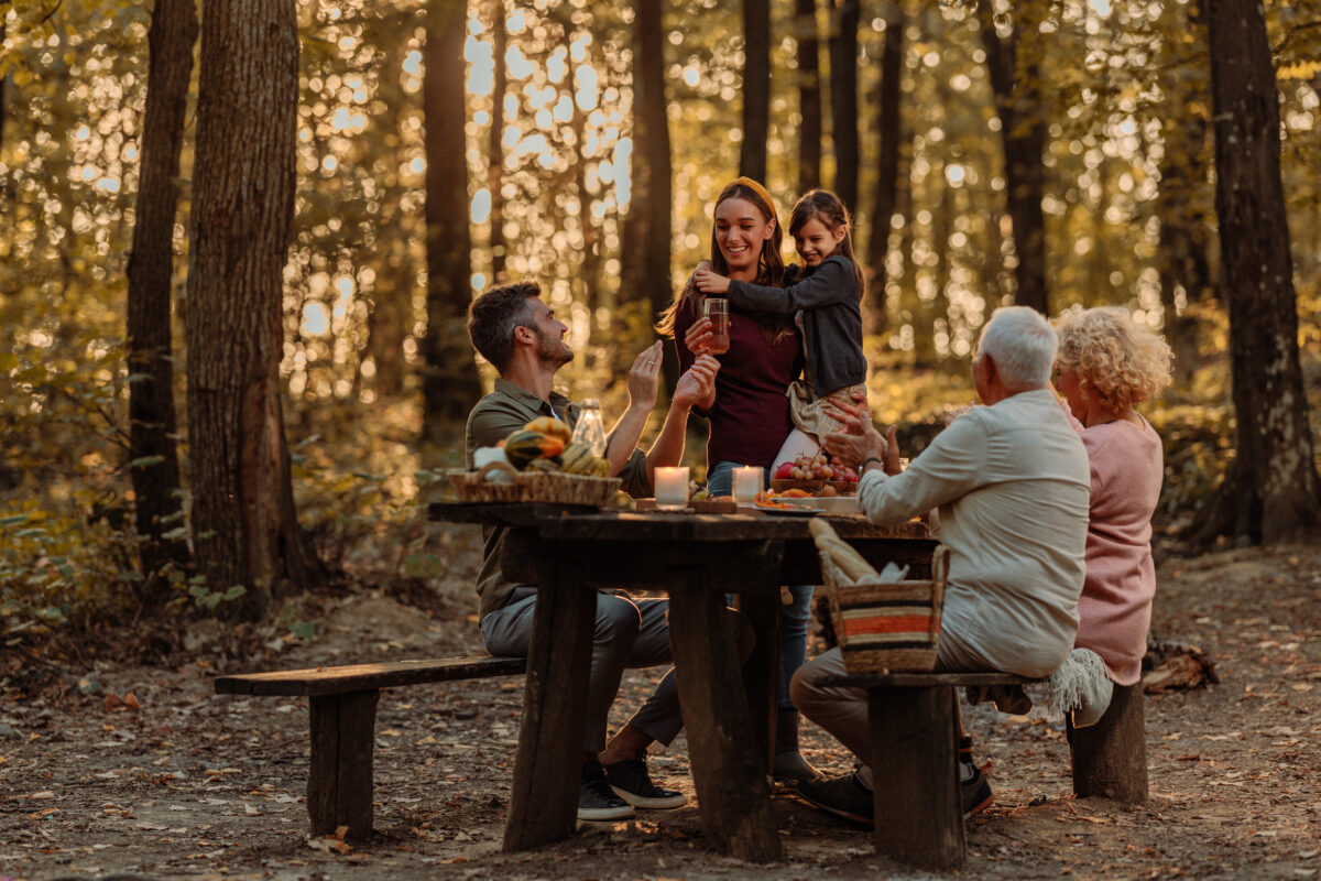 Family enjoying picnic in the woods
