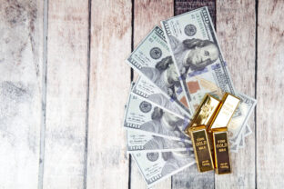Directly Above Shot Of Ingots And Paper Currency On Table