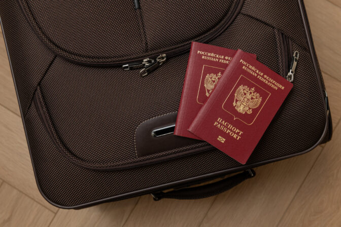 Two passports for travel abroad, a citizen of the Russian Federation and a suitcase for travel
