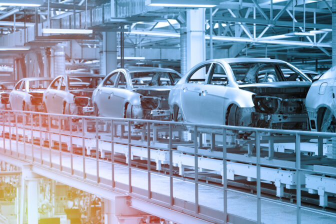 Car bodies are on Assembly line. Factory for production of cars in blue. Modern automotive industry. Blue tone