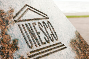 UNESCO world heritage sign carved on stone