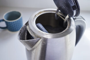 Close Up Of Electric Kettle With Limescale In Hard Water Area