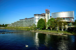 European Court of Human Rights in Strasbourg clear sky and swan in river