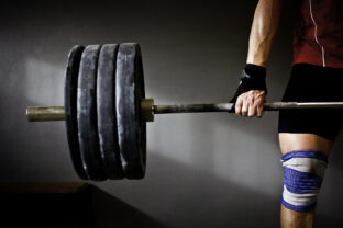 Man practising weightlifting III