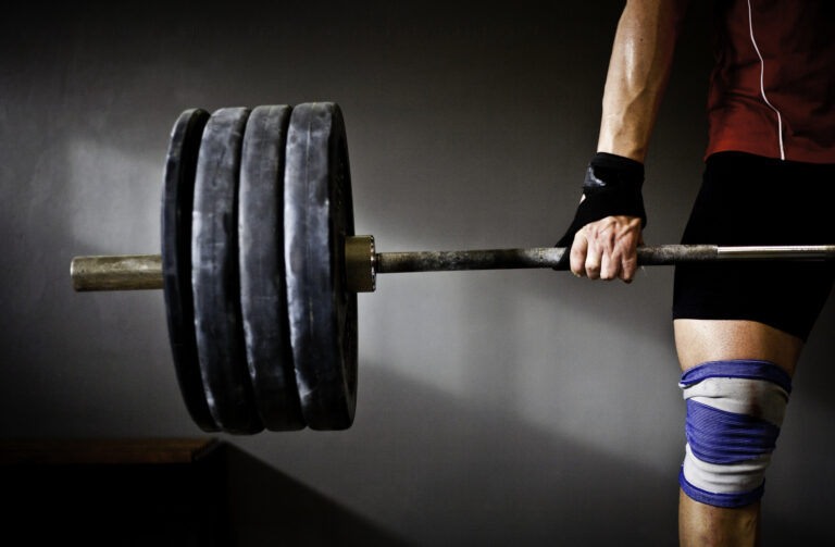 Man practising weightlifting III