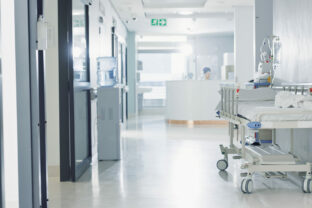 Hospital, healthcare and medical with an empty corridor for wellness, care or treatment and disease control. Medicine, service and hallway of a lobby in a clinic for rehabilitation or recovery